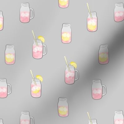 pink lemonade w/ straws - summer time drinks on grey  