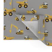 construction trucks - yellow on grey