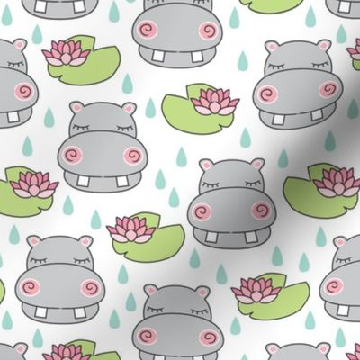 grey hippos and water lilies