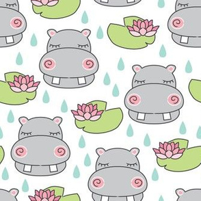 grey hippos and water lilies