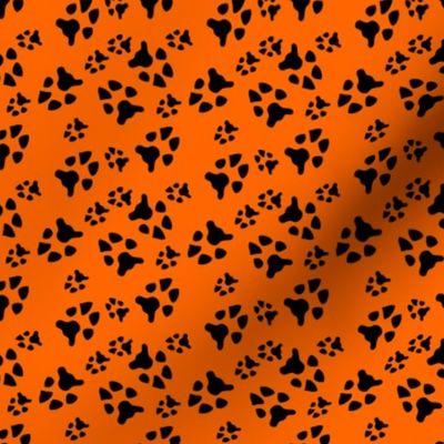 paw prints black on orange