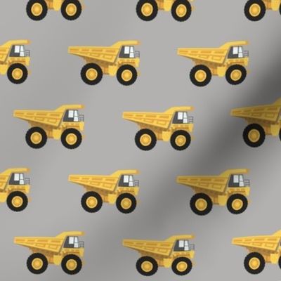 dump trucks - yellow on grey