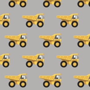 dump trucks - yellow on grey