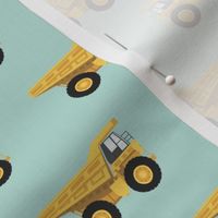 dump trucks - yellow on dark mint