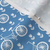Bikes on solid sky blue