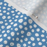 Dots on solid sky blue