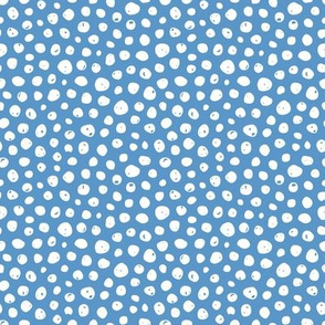 Dots on solid sky blue