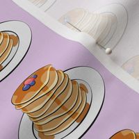 pancakes with berries on light purple