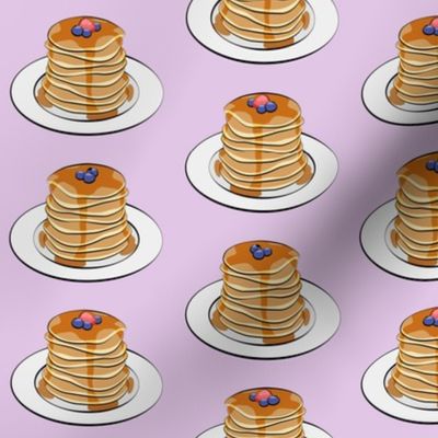 pancakes with berries on light purple