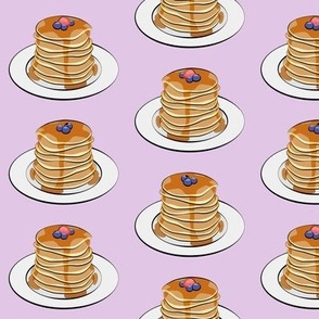 pancakes with berries on light purple