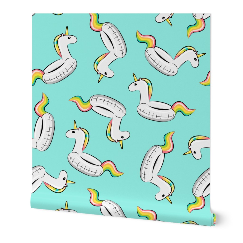 unicorn pool float toss on light teal