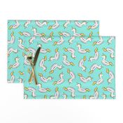 unicorn pool float toss on light teal