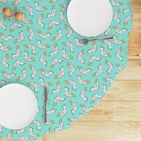 unicorn pool float toss on light teal