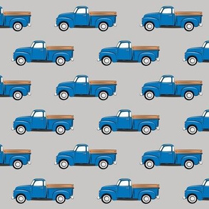 vintage blue truck on grey