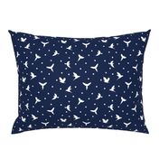 White flying birds on dark blue