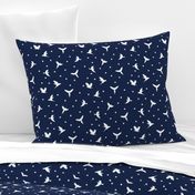 White flying birds on dark blue