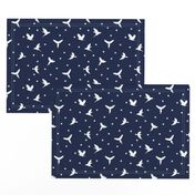 White flying birds on dark blue