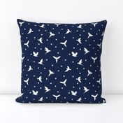 White flying birds on dark blue