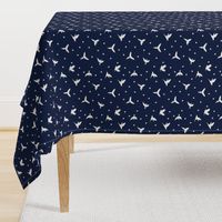 White flying birds on dark blue