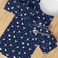 White flying birds on dark blue