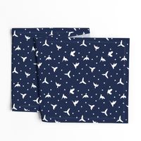 White flying birds on dark blue