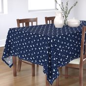 White flying birds on dark blue