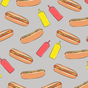 hot dogs on grey w/ condiments