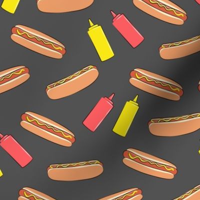 hot dog on dark grey with condiments