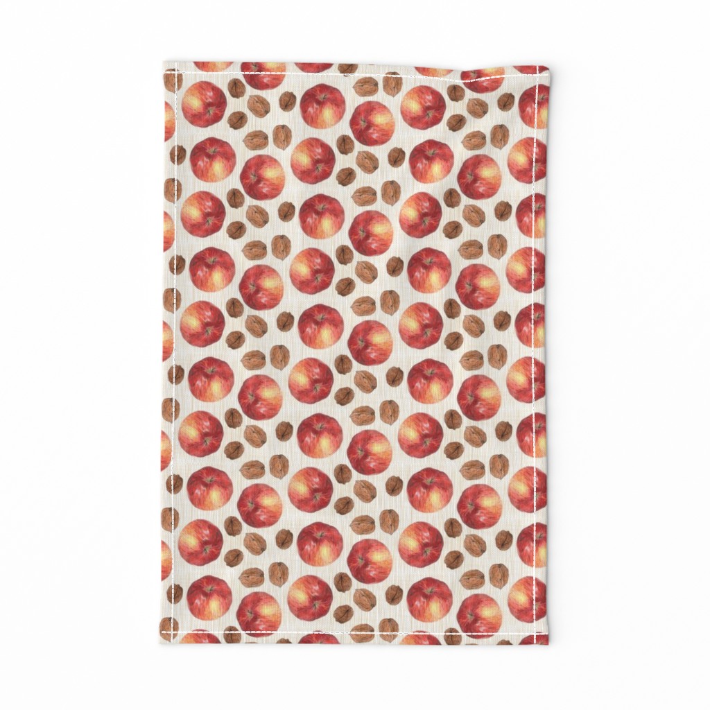 autumn fruit: apple and walnuts on beige linen texture