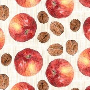 autumn fruit: apple and walnuts on beige linen texture