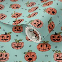 Jack-o'-lantern halloween cute pumpkin carving hand drawn pattern light blue by andrea lauren