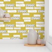 Strips and spots abstract dots Scandinavian art texture gender neutral mustard