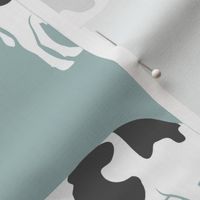 large scale - cows on dusty blue