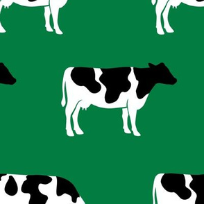 large scale - cows on green