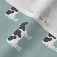 cows on dusty blue