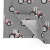 light pink tractors on grey - farm fabric