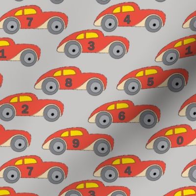 vintage-red cars-with-numbers-on grey