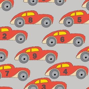vintage-red cars-with-numbers-on grey