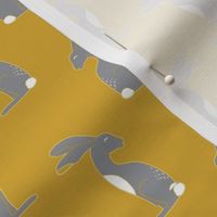 Grey and white hares on mustard yellow