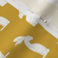 White rabbits on mustard yellow