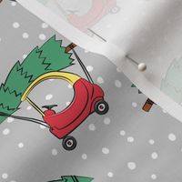 kids car with Christmas tree on grey w/ snow
