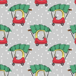 kids car with Christmas tree on grey w/ snow