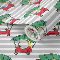 kids car with Christmas tree on grey stripes