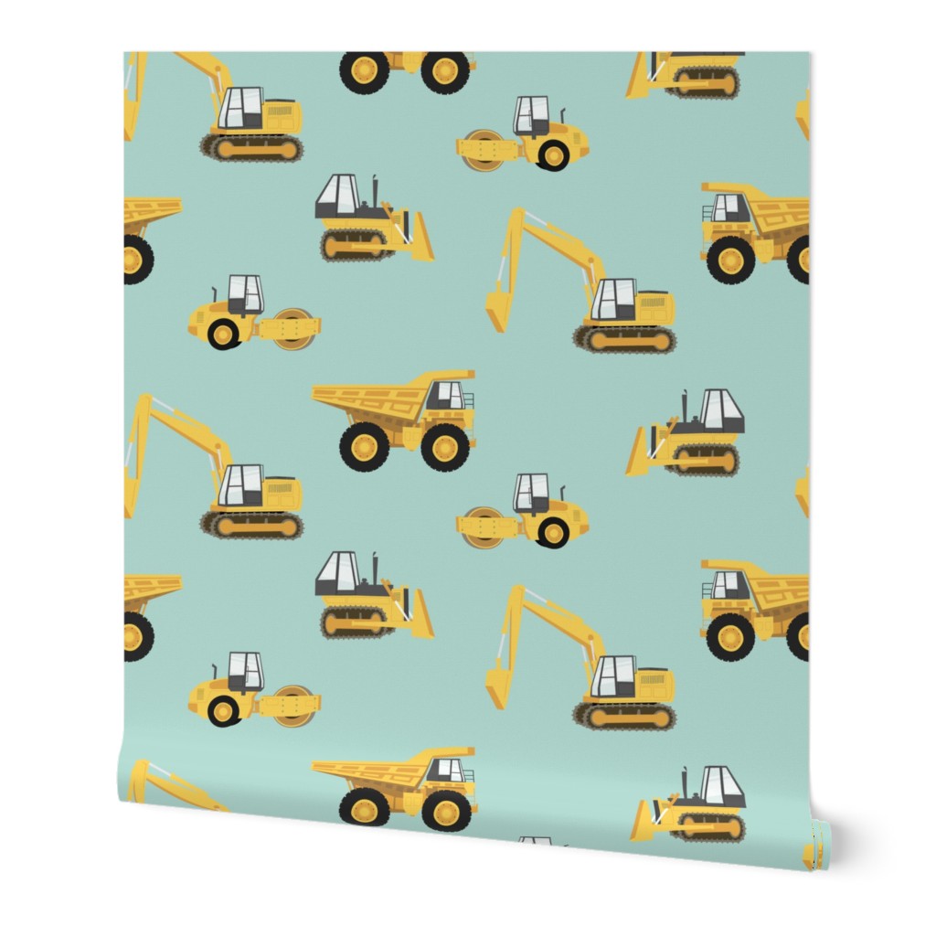 (large scale) construction trucks - yellow on dark mint