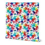 autism awareness - watercolor puzzle pieces with splatter