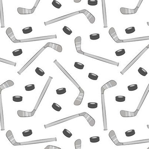 hockey sticks and pucks - monochrome on white