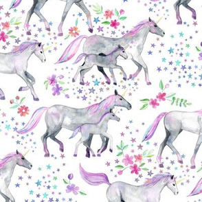 Mom and baby unicorns with pastel manes and tails on white