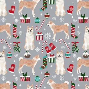 Akita dog breed christmas presents  candy canes snowflakes fabric grey