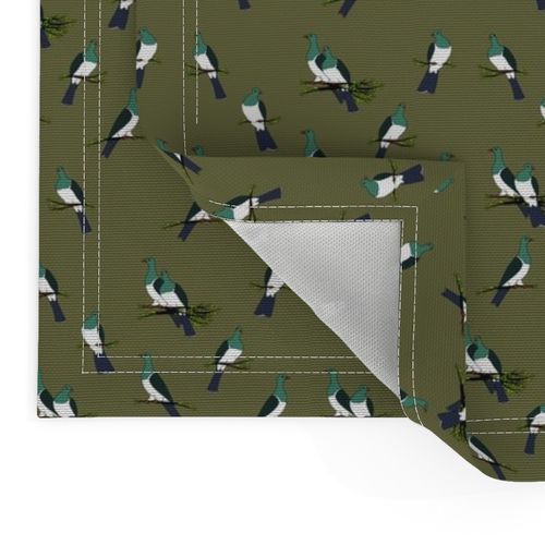 Kereru scatter on olive green sky