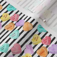 valentines day heart candy - conversation hearts  on stripes